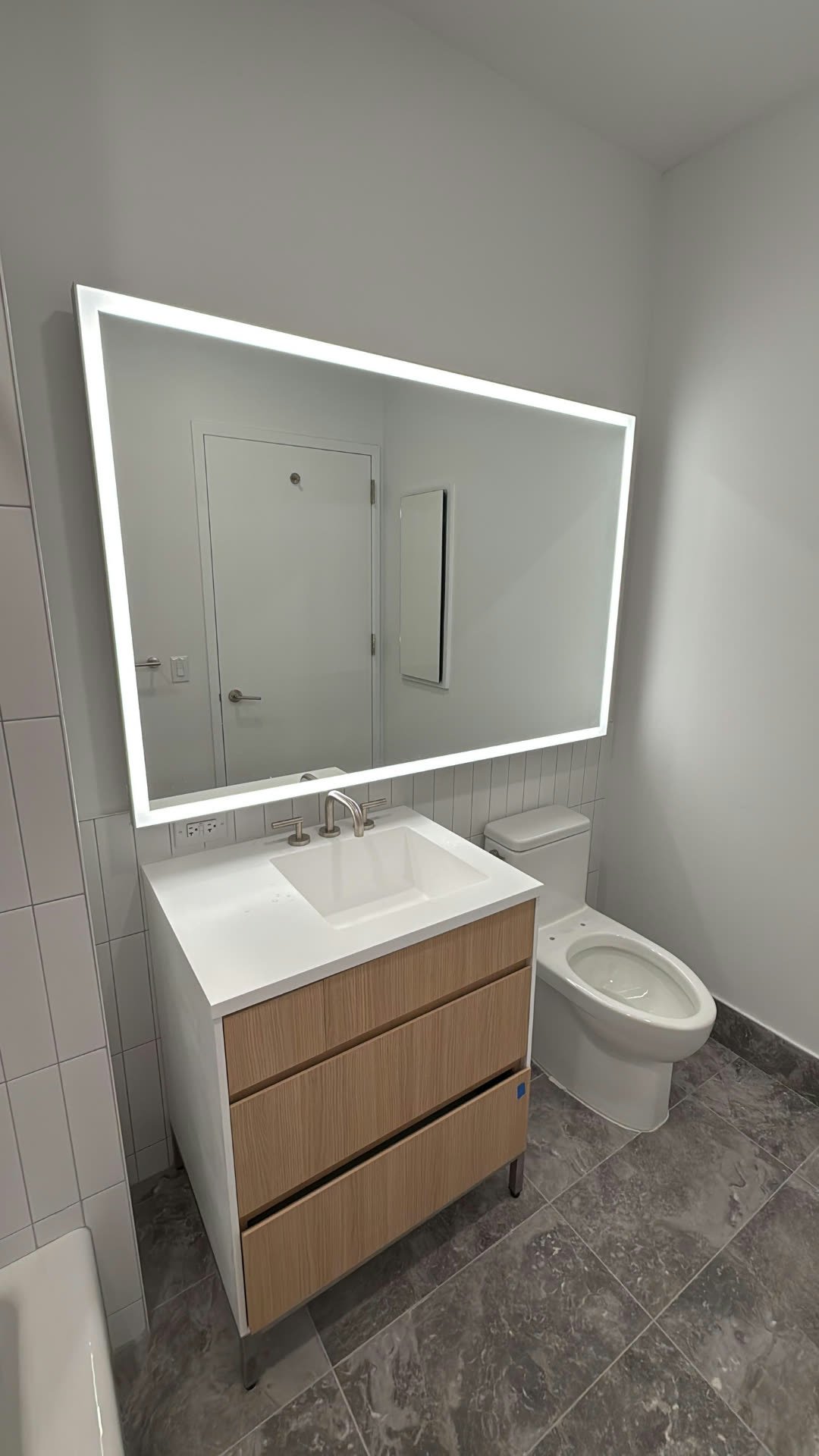 Custom backlit LED vanity mirror installation